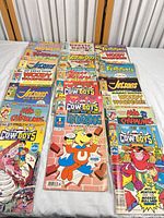 All comics spread in three columns on table