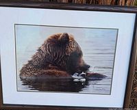 Front view of framed photograph showing image, matting, frame, and signature