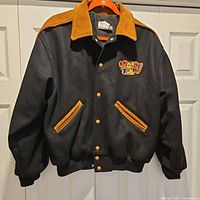 Front view of jacket showing overall style and patch
