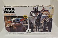 Front of sealed 2-pack puzzle box showing Grogu and Mandalorian images and 500-piece count