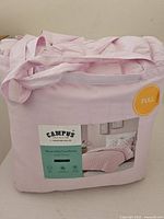 Comforter in carry bag showing size label