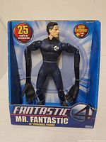 Front of boxed Mr. Fantastic figure showing window display and branding