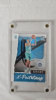 Front view of LaMelo Ball Great X-Pectations rookie card inside acrylic case
