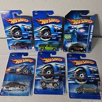 Front view of all six Hot Wheels cards
