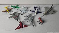 Group shot showing all nine toy planes