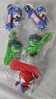 All five packaged Marvel keychains visible