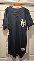 Full front view of Yankees Cool Base jersey on hanger