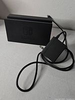 Front view of Nintendo Switch dock and AC adapter