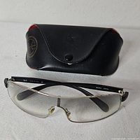 Ray-Ban shield glasses with case closed behind