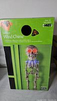 Retail box front for Walmart Dept.18 Skeleton Wind Chime showing product image and features