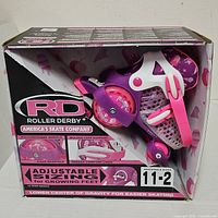 Retail box showing brand, model and size information with skates visible through window