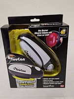 Front of boxed TouCan can opener showing product and branding