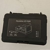Exterior of hard case labeled Adjustable LED RMR