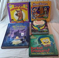 Group shot of five hardcover children’s books