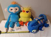 Three plush toys together to show lot contents and relative size