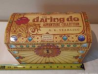 Front of Daring Do Adventure Collection storage box with ruler for scale