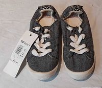 Top view of both sneakers with tag attached