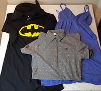 Group shot of Batman tunic, Adidas polo dress, Volcom tank dress