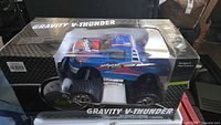 Front angled view of boxed Gravity V-Thunder truck
