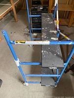 Full view showing steel frame, plywood planks, casters