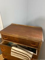 Top surface showing gallery edge and first drawer