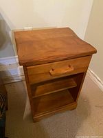 Front and top view of light brown wood veneer nightstand