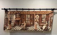 Full view of tapestry on wall showing entire scene and hanging method