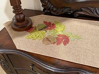 Full view of runner on furniture showing appliqué end