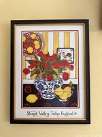 Full view of framed Skagit Valley Tulip Festival poster on wall