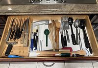 Drawer overview showing knives, utensils and tools