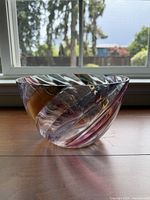 Front view of multicolor stripe swirl glass vase