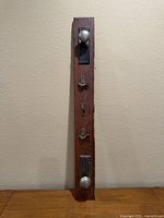 Full view of wood rack showing two knobs and two latches