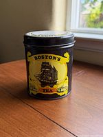 Front view showing Boston’s Tea label and ship graphic