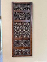 Front view of entire carved wood panel