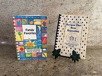 Front covers of both cookbooks on countertop
