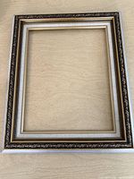 Full view of ornate rectangular wood frame