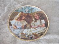 Front view showing artwork and gold rim