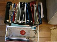 Top view showing binders standing in basket with clipboard