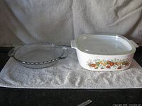 Casserole with lid and pie plate side by side