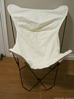 Chair open, showing canvas seat and frame