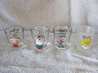 Front view of four character shot glasses