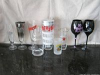 Full group of cocktail shaker and assorted glasses