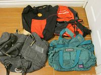 Overview of five bags on floor