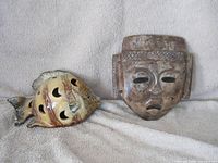 Mask and ceramic fish shown side by side on neutral background