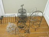 Group shot of six metal serving and display racks