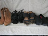front view of four pairs shoes side by side