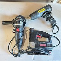 Overview of the three corded power tools on table
