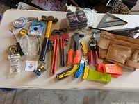 Overview of all assorted tools and pouch on table