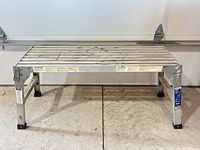 Top view of aluminum slat deck and folding legs