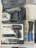 Group view inside cases showing all three tools and accessories